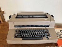 Front view of IBM Correcting Selectric II typewriter on wooden table