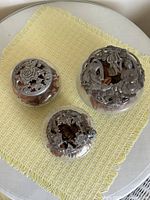 All three glass dishes with pewter lids shown together