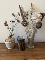 Group shot: ceramic planter with faux flowers, mosaic glass holder, tall vase with faux stems