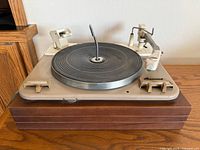 Front view of Garrard Type A turntable on wood plinth