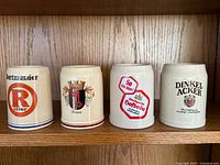 Front view of all four steins