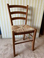 Full front view of cherry ladder-back chair
