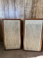 Front view of both JBL Lancer 33 speakers showing intact grilles and cabinets