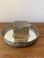 Mirrored tray with jewelry box centered, showing overall lot