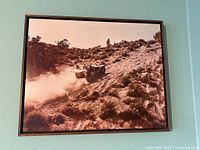 Full view of framed photograph on wall