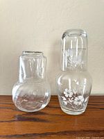 Both bedside carafe sets side by side showing overall form