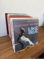 Front view showing André Previn & David Rose "Like Blue" album and remainder of record stack