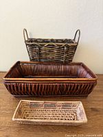 All three rectangular woven baskets grouped for scale