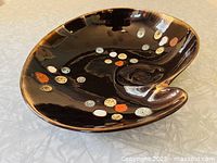 Top angled view showing overall kidney shape and glaze pattern