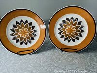 Front view of both Kingstone Blaze plates showing pattern and color