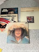 Group shot of all five Paul Simon album covers