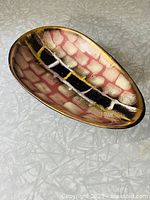 Top angle view of oval ceramic bowl showing geometric design