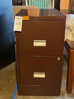 Front view showing two drawers and lock