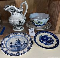 Group shot showing pitcher, hexagonal bowl on matching plate, two decorative plates in front