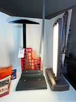 Overall view showing two lamps, drafting tools, red organizer and velvet case