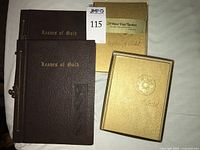 Front covers of two Leaves of Gold books and two Apples of Gold slipcased books
