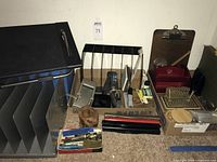 Group view of foot rest, file sorter, magazine holders, organizers and supply box