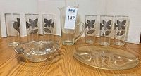 All items grouped: six tumblers, carafe, divided dish, gold-pattern plate