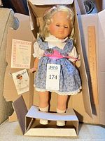 Full doll in box with accessories and ruler for scale