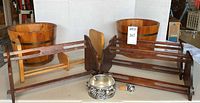 Two cedar buckets, four wood book racks, silver-tone coaster and stopper displayed together