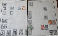 Both album pages side by side showing all mounted stamps