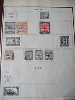 Full Sudan album page showing eight mounted stamps