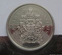 Reverse of 2005 Canadian 50-cent coin showing Canadian Coat of Arms and denomination
