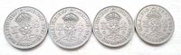 Group of four UK two shilling coins obverse side