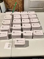 Multiple boxed transformers arranged on table