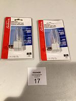 Two sealed Sunbeam automatic night lights side by side