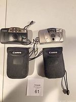 Two Canon 35mm cameras and two Canon cases overview