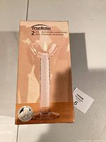 Front of box showing Trudeau Archimedes candle holders, 2 pieces