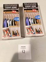 Two sealed Closet Genie boxes front view