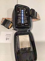 Overall view of Black Box SAM V.35 tester with ribbon cables and case