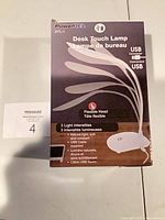 Front of box showing model, brand, features