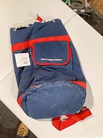 Full view of blue duffle bag lying on table