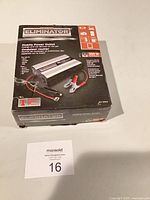 Front view of sealed Eliminator Mobile Power Outlet 300W box showing product image and specifications