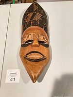 Full view of carved wooden mask