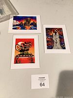 Overview of three matted Indigenous art prints