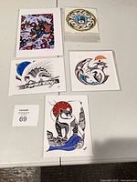 All five prints laid out on table