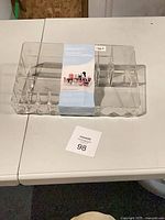 Top view of entire acrylic organizer with packaging band