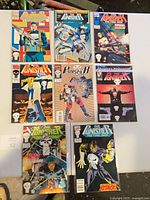 Group shot of eight bagged The Punisher comics on table