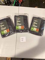 Three sealed Mountain Ridge thermal pants packages displayed on table