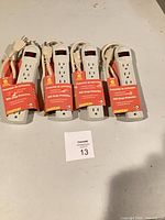 Four packaged Chateau PB-6S power strips on table
