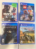 Group shot of all four PS4 game cases