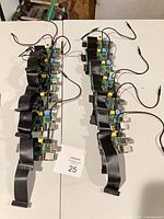 Two rows of Raspberry Pi 1 Model B boards with ribbon cables and USB leads, total about 14 units