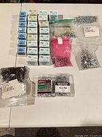 Overview of all screw boxes and bags on table