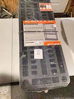 Sealed package showing full shelving unit and label