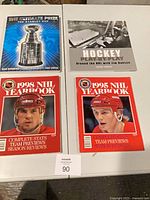 Four NHL hockey books displayed on table