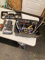 overview of toolbox and additional trays on table
